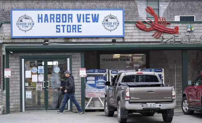 A lobster is part of the decorations at the Harbor View store in Stonington, Maine, on Friday, May 2, 2025. (AP Photo/Robert F. Bukaty)