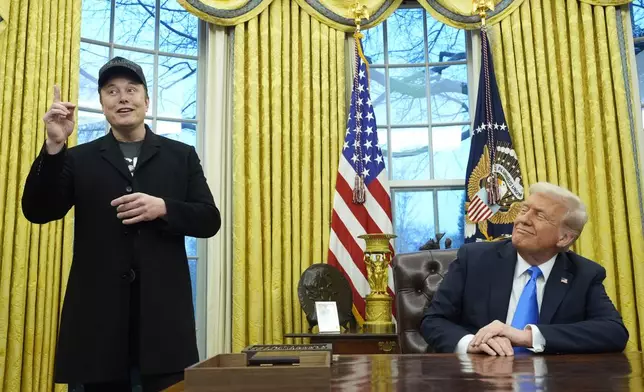 FILE - President Donald Trump listens as Elon Musk speaks in the Oval Office at the White House, Feb. 11, 2025, in Washington. (AP Photo/Alex Brandon, File)