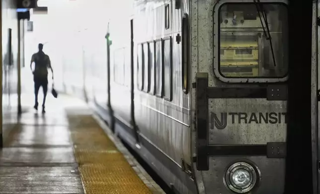 An NJ Transit train leaves the Secaucus Junction station in Secaucus, N.J., Wednesday, May 14, 2025. (AP Photo/Seth Wenig)