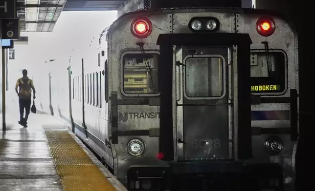 An NJ Transit train leaves the Secaucus Junction station in Secaucus, N.J., Wednesday, May 14, 2025. (AP Photo/Seth Wenig)