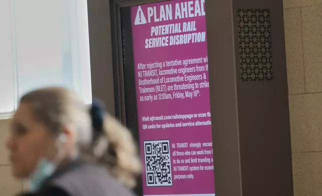 An electronic display advises commuters of potential NJ Transit service disruptions at the Secaucus Junction station in Secaucus, N.J., Wednesday, May 14, 2025. (AP Photo/Seth Wenig)