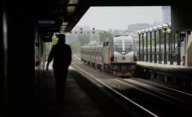 An NJ Transit train pulls into the Secaucus Junction station in Secaucus, N.J., Wednesday, May 14, 2025. (AP Photo/Seth Wenig)