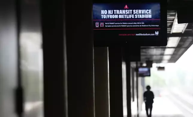 An electronic display advises commuters of NJ Transit service disruptions at the Secaucus Junction station in Secaucus, N.J., Wednesday, May 14, 2025. (AP Photo/Seth Wenig)