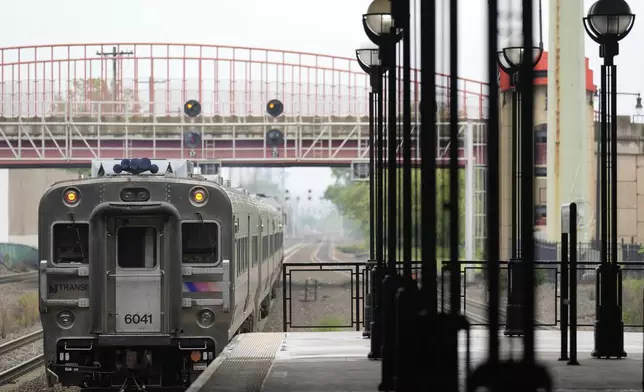 An NJ Transit train leaves the Secaucus Junction station in Secaucus, N.J., Wednesday, May 14, 2025. (AP Photo/Seth Wenig)