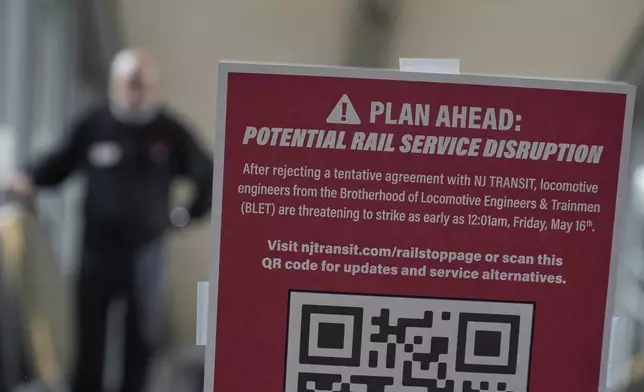 An sign advises commuters of potential NJ Transit service disruptions at the Secaucus Junction station in Secaucus, N.J., Wednesday, May 14, 2025. (AP Photo/Seth Wenig)