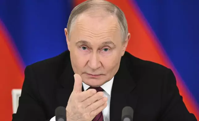 Russian President Vladimir Putin gestures as he speaks to journalists in the Grand Palace at the Kremlin in Moscow, Russia, Sunday, May 11, 2025, after celebrations of the 80th anniversary of the Soviet Union's victory over Nazi Germany during World War II. (Sergei Bobylev/Photo host agency RIA Novosti via AP)