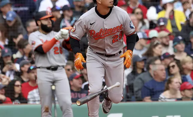 Baltimore Orioles' Ramón Urías runs to first base after hitting a sacrifice fly, running in a player, during the fourth inning of a baseball game against the Boston Red Sox, Sunday, May 25, 2025, in Boston. (AP Photo/Mark Stockwell)