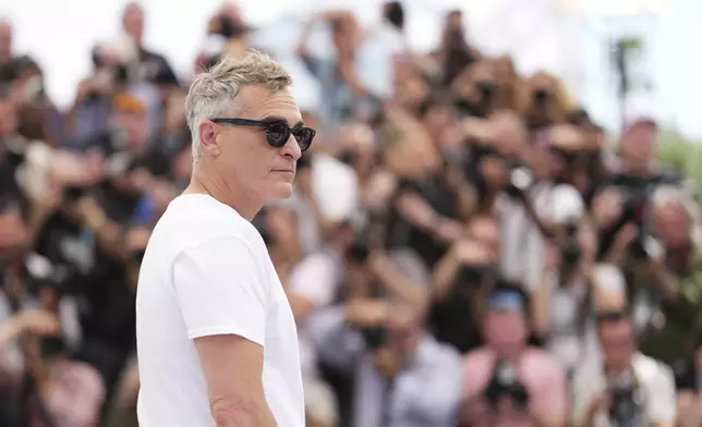 Joaquin Phoenix poses for photographers at the photo call for the film 'Eddington' at the 78th international film festival, Cannes, southern France, Saturday, May 17, 2025. (Photo by Scott A Garfitt/Invision/AP)