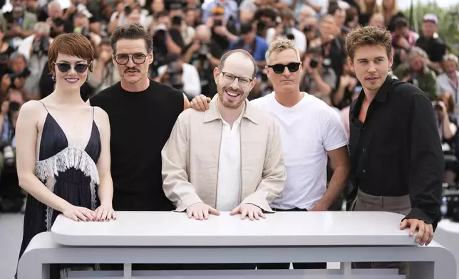 Emma Stone, from left, Pedro Pascal, director Ari Aster, Joaquin Phoenix and Austin Butler pose for photographers at the photo call for the film 'Eddington' at the 78th international film festival, Cannes, southern France, Saturday, May 17, 2025. (Photo by Scott A Garfitt/Invision/AP)