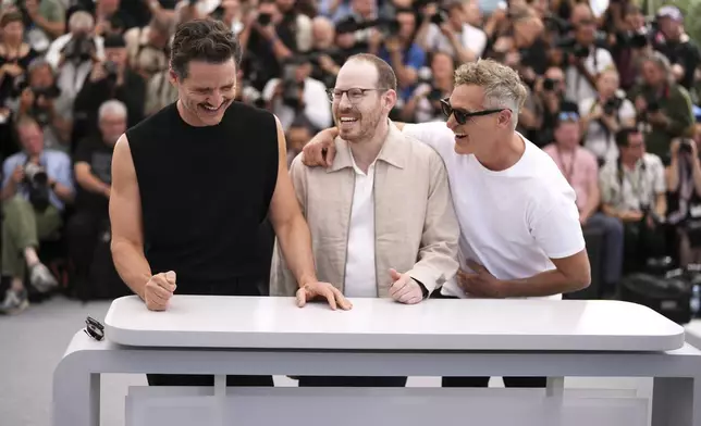 Pedro Pascal, from left, director Ari Aster and Joaquin Phoenix pose for photographers at the photo call for the film 'Eddington' at the 78th international film festival, Cannes, southern France, Saturday, May 17, 2025. (Photo by Scott A Garfitt/Invision/AP)