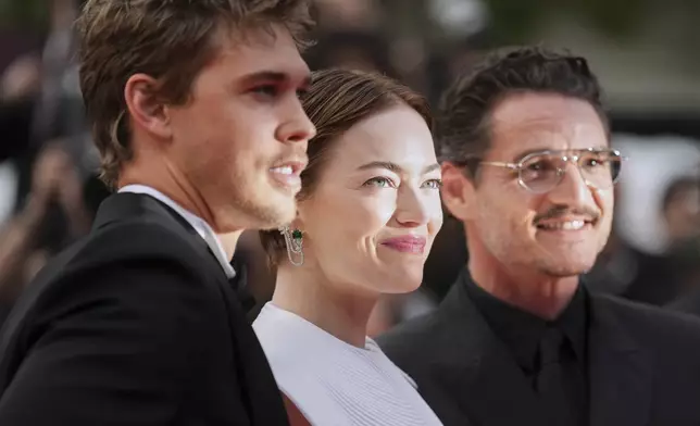 Austin Butler, from left, Emma Stone and Austin Butler pose for photographers upon arrival at the premiere of the film 'Eddington' at the 78th international film festival, Cannes, southern France, Friday, May 16, 2025. (AP Photo/Natacha Pisarenko)