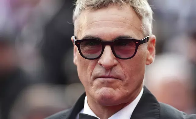 Joaquin Phoenix poses for photographers upon arrival at the premiere of the film 'Eddington' at the 78th international film festival, Cannes, southern France, Friday, May 16, 2025. (Photo by Scott A Garfitt/Invision/AP)