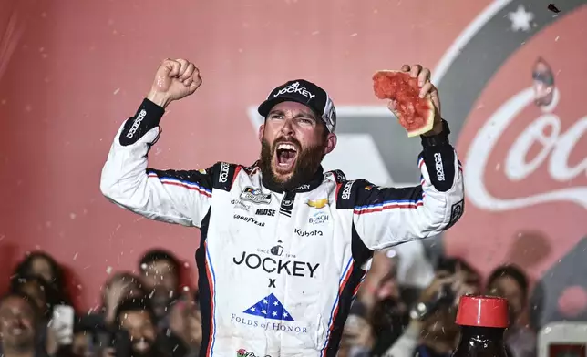 Ross Chastain celebrates in Victory Lane after winning a NASCAR Cup Series auto race at Charlotte Motor Speedway, Sunday, May 25, 2025, in Concord, N.C. (AP Photo/Matt Kelley)