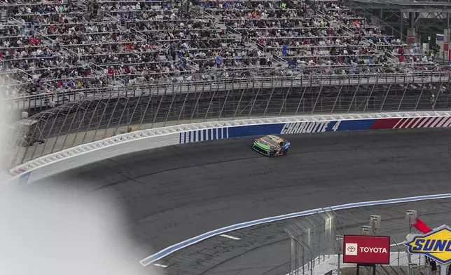 Bubba Wallace steers through Turn 4 during a NASCAR Cup Series auto race at Charlotte Motor Speedway, Sunday, May 25, 2025, in Concord, N.C. (AP Photo/Matt Kelley)