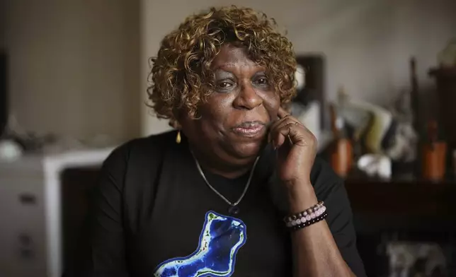Chagossian Bernadette Dugasse pauses, during an interview with The Associated Press, at her home in London, Tuesday, March 25, 2025. (AP Photo/Kin Cheung)