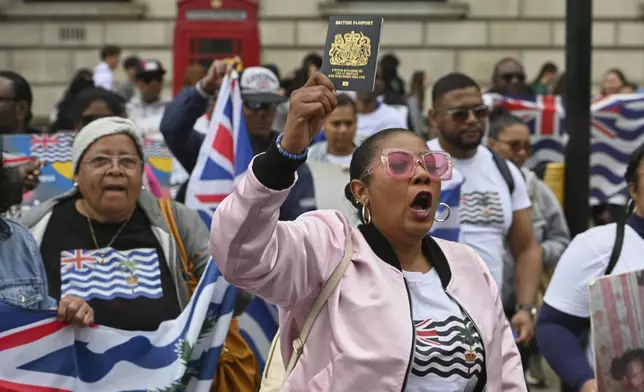 People demonstrate outside the Foreign Office in London, Thursday, May 22, 2025, after a British court blocked the U.K. from transferring sovereignty over the Chagos Islands to Mauritius hours before the agreement was due to be signed. (AP Photo/Thomas Krych)