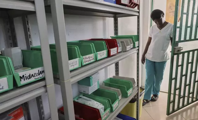 A nurse enters the medicine inventory room at New Hope Hospital in Plaine-du-Nord, Haiti, Wednesday, May 21, 2025. (AP Photo/Patrice Noel)
