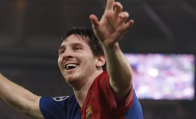 FILE - Barcelona's Lionel Messi celebrates after scoring his sides second goal during the UEFA Champions League final soccer match between Manchester United and Barcelona in Rome, May 27, 2009. (AP Photo/Luca Bruno, File)
