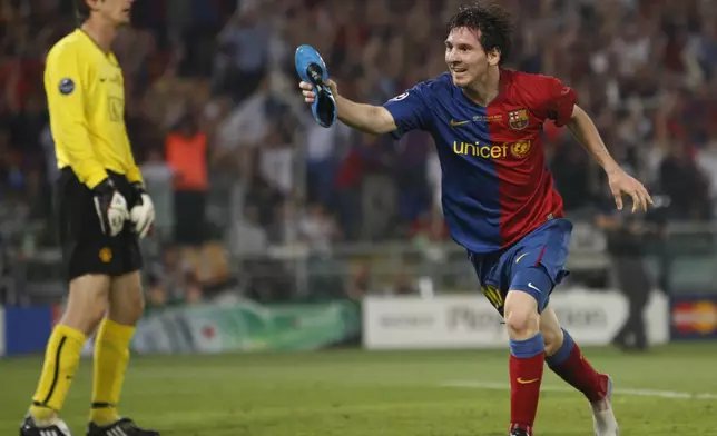 FILE - Barcelona's Lionel Messi shows his shoe as he reacts after scoring his side second goal, during the UEFA Champions League final soccer match between Manchester United and Barcelona in Rome, May 27, 2009. (AP Photo/Luca Bruno, File)