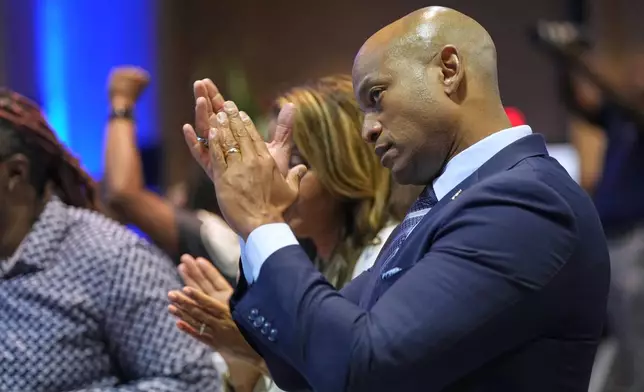 Maryland Gov. Wes Moore applauds as former Democratic National Committee Chair Jaime Harrison speaks at the South Carolina Democratic Party's Blue Palmetto Dinner Friday, May 30, 2025, in Columbia, S.C. (AP Photo/Meg Kinnard)