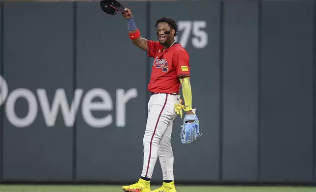 Atlanta Braves outfielder Ronald Acuna Jr. reacts after making an outfield assist in the eighth inning of a baseball game against the San Diego Padres, Friday, May 23, 2025, in Atlanta. (AP Photo/Colin Hubbard)