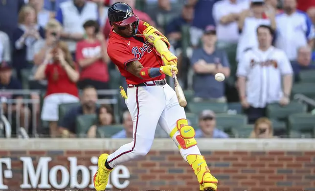 Atlanta Braves' Ronald Acuna Jr. hits a home run in the first inning of a baseball game against the San Diego Padres, Friday, May 23, 2025, in Atlanta. (AP Photo/Colin Hubbard)