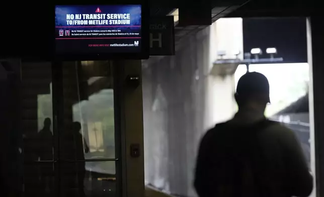 An electronic display advises commuters of NJ Transit service disruptions at the Secaucus Junction station in Secaucus, N.J., Wednesday, May 14, 2025. (AP Photo/Seth Wenig)