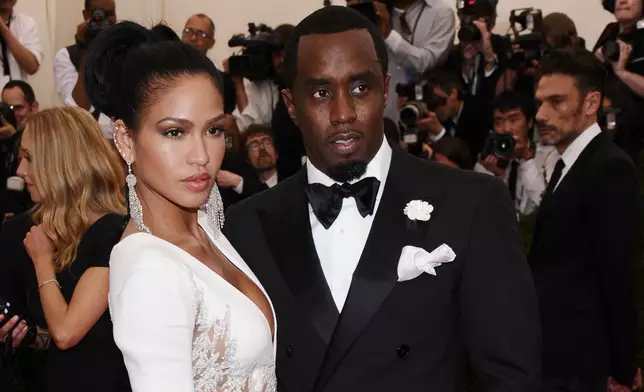 FILE - Cassie Ventura, left, and Sean "Diddy" Combs appear at The Metropolitan Museum of Art's Costume Institute benefit gala celebrating "China: Through the Looking Glass" in New York on May 4, 2015. (Photo by Charles Sykes/Invision/AP, File)
