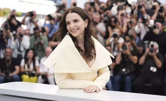 Jury member Juliette Binoche poses for photographers at the jury photo call at the 78th international film festival, Cannes, southern France, Tuesday, May 13, 2025. (AP Photo/Natacha Pisarenko)