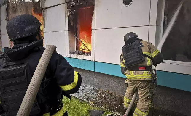 In this photo provided by the Ukrainian Emergency Service, firefighters put out the fire following Russia's drone attack in the Kyiv region, Ukraine, Sunday, May 18, 2025. (Ukrainian Emergency Service via AP)