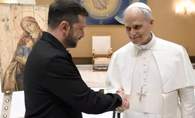 This picture made available by Vatican Media on Sunday, May 18, 2025, shows Pope Leo XIV meeting Ukraine's President Volodymyr Zelenskyy at the Vatican. (Vatican Media via AP)