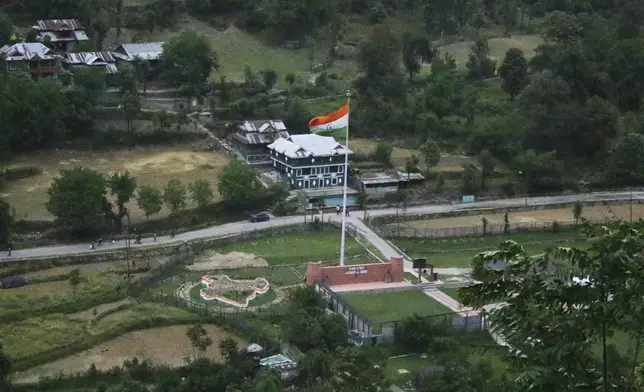 An Indian army post is seen from a hill view tourists point in Karen, in the Neelum Valley near on the Line of Control, the de facto border that divides the disputed region of Kashmir, some 93 kilometres (58 miles) from Muzaffarabad, the capital of Pakistan controlled Kashmir, Thursday, May 1, 2025. (AP Photo/Ishfaq Hussain)