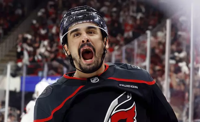 Carolina Hurricanes' Seth Jarvis celebrates after his goal against the Washington Capitals during the second period of Game 4 of a second-round NHL hockey playoff series in Raleigh, N.C., Monday, May 12, 2025. (AP Photo/Karl DeBlaker)