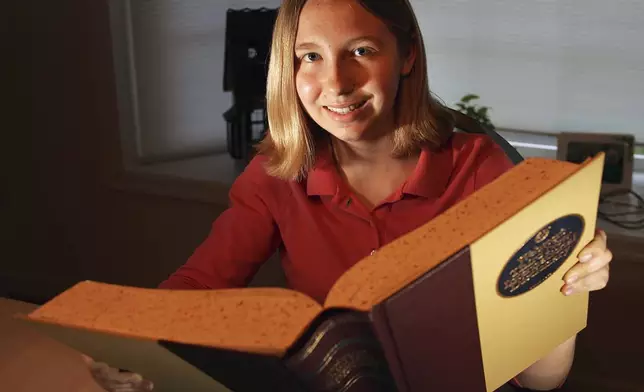 FILE - Katharine "Kerry" Close, 13, poses at home in Spring Lake, N.J., May 24, 2006. (AP Photo/Tim Larsen, File)