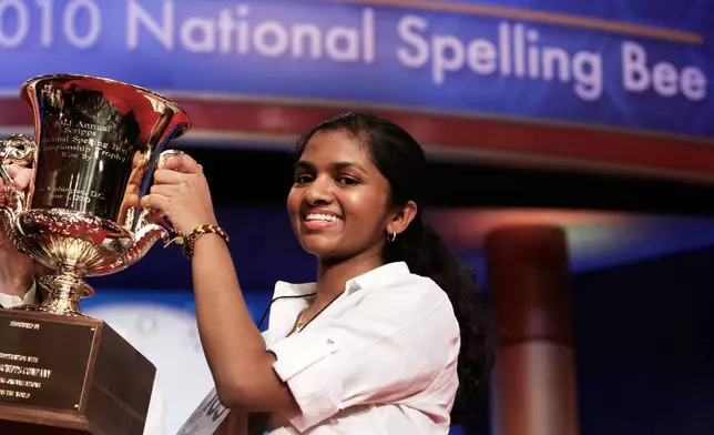 FILE - Anamika Veeramani, 14, of North Royalton, Ohio, holds her trophy after winning the 2010 National Spelling Bee in Washington, June 4, 2010. (AP Photo/Jacquelyn Martin, File)