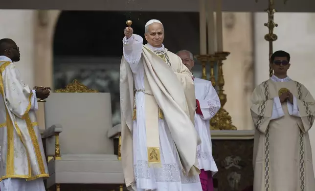 Pope Leo XIV holds Mass during the formal inauguration of his pontificate in St. Peter's Square attended by heads of state, royalty and ordinary faithful, Sunday, May 18, 2025. (AP Photo/Alessandra Tarantino)