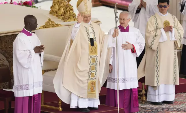 Pope Leo XIV waves at the end of a Mass for the formal inauguration of his pontificate, in St. Peter's Square, at the Vatican, Sunday, May 18, 2025.(AP Photo/Gregorio Borgia)