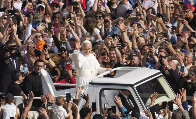 Pope Leo XIV on his popemobile tours St. Peter's Square at the Vatican prior to the inaugural Mass of his pontificate, Sunday, May 18, 2025. (AP Photo/Domenico Stinellis)