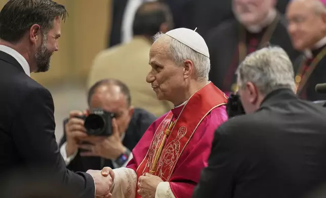 Pope Leo XIV meets Vice President JD Vance after the formal inauguration of his pontificate in St. Peter's Square, at the Vatican, Sunday, May 18, 2025. (AP Photo/Alessandra Tarantino)