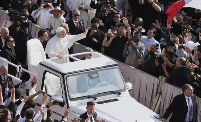 Pope Leo XIV on his popemobile tours St. Peter's Square at the Vatican prior to the inaugural Mass of his pontifcate, Sunday, May 18, 2025. (AP Photo/Jacquelyn Martin, Pool)