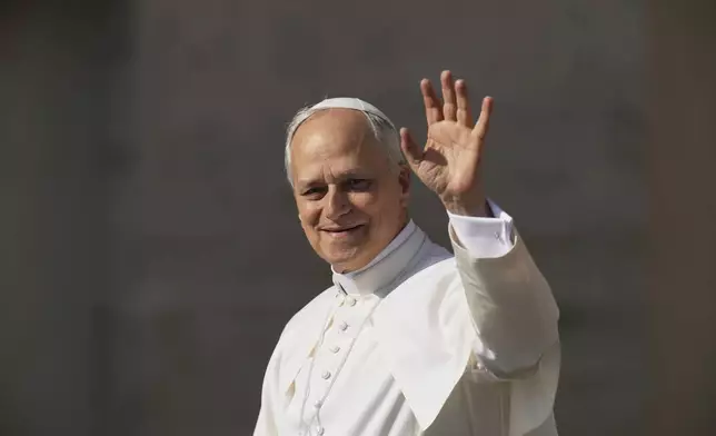 Pope Leo XIV's waves to people before his formal inauguration of his pontificate with a Mass in St. Peter's Square attended by heads of state, royalty and ordinary faithful, Sunday, May 18, 2025. (AP Photo/Alessandra Tarantino)