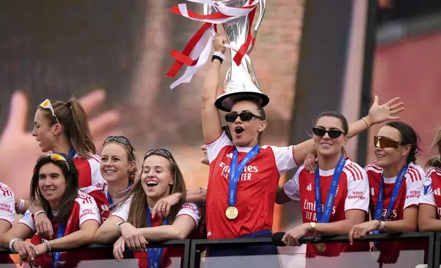 Arsenal's Katie McCabe holds the trophy during the Women's Champions League Winners parade in London, Monday, May 26, 2025. (Adam Davy/PA via AP)