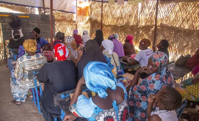 Sidi Yaya Sangare teaches Bambara in a makeshift classroom in the village of Mountougoula, Mali, April 7, 2025. (AP Photo/Saydou Camara)