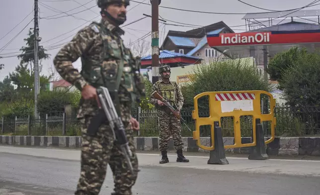Indian paramilitary soldiers stands guard at a temporary check point on a road leading to the airport after loud explosions were heard in Srinagar, in Indian controlled Kashmir, Saturday, May 10, 2025.(AP Photo/Dar Yasin)