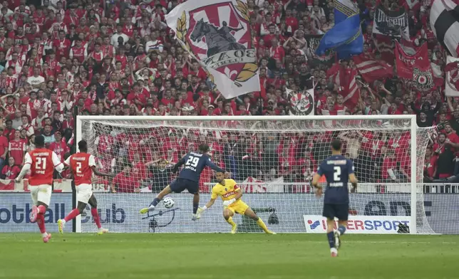 PSG's Bradley Barcola (29) scores his side's opening goal during the French Cup soccer final between Paris Saint-Germain and Reims at the Stade de France stadium in Saint-Denis, outside Paris, Saturday, May 24, 2025. (AP Photo/Aurelien Morissard)