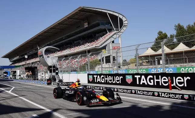 Red Bull driver Max Verstappen of the Netherlands steers his car into the pits during the second free practice ahead of the Spanish Grand Prix Formula One race at the Barcelona Catalunya racetrack in Montmelo, near Barcelona, Spain, Friday, May 30, 2025. (AP Photo/Joan Monfort)
