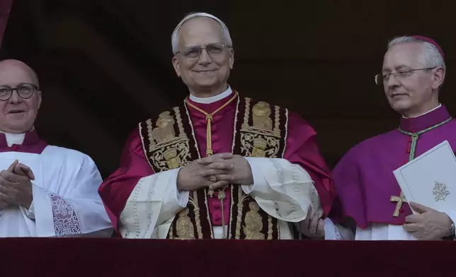 Newly elected Pope Leo XIV appears at the balcony of St. Peter's Basilica at the Vatican, Thursday, May 8, 2025. (AP Photo/Andrew Medichini)