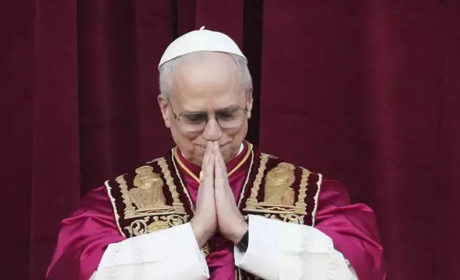 ope Leo XIV appears on the central loggia of St. Peter's Basilica after being chosen the 267th pontiff of the Roman Catholic Church, at the Vatican, Thursday, May 8, 2025. (AP Photo/Alessandra Tarantino)