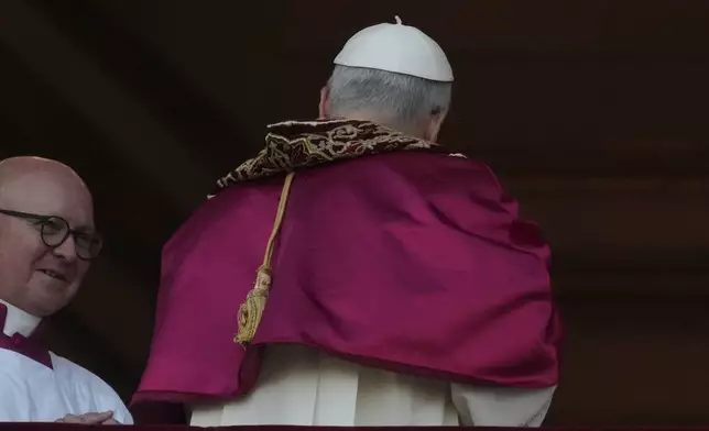 Newly elected Pope Leo XIV leaves after appearing on the balcony of St. Peter's Basilica at the Vatican, Thursday, May 8, 2025. (AP Photo/Andrew Medichini)