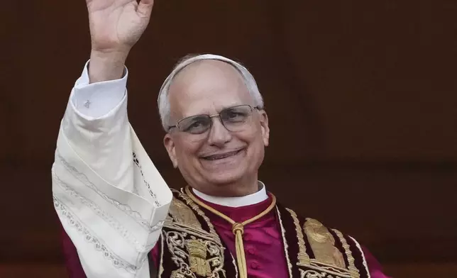 Newly elected Pope Leo XIV appears at the balcony of St. Peter's Basilica at the Vatican, Thursday, May 8, 2025. (AP Photo/Alessandra Tarantino)